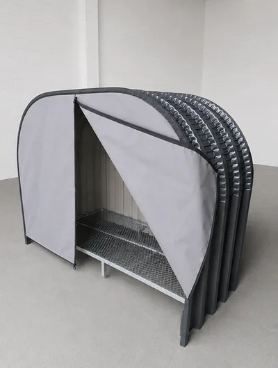 Firewood shed with protective backing and a fitted canvas cover across the front of the shed