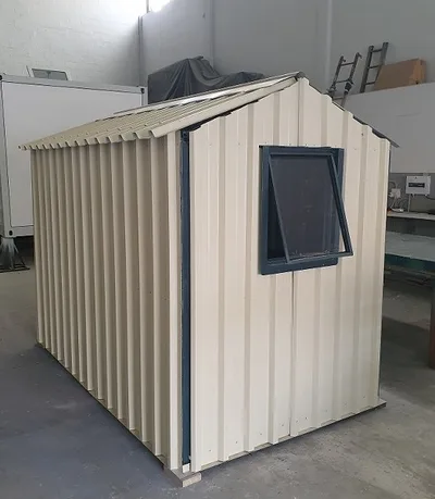 Rear view of the garden shed in the workshop showing the side window and roof overhang